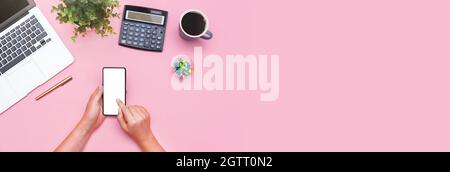 Woman using mobile app, smart phone with blank screen, flat lay Stock Photo