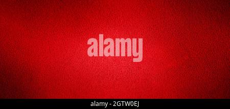 Horizontal web banner. Red background natural suede with a dark edge and a light center. Stock Photo