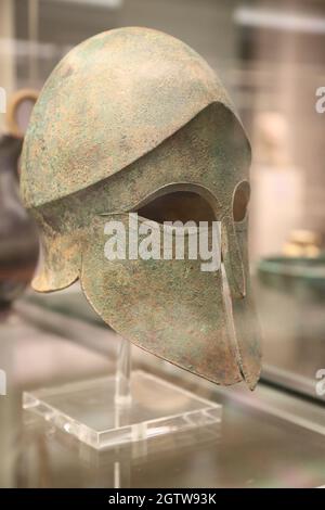 Greek helmet of Corinthian type displayed at the British Museum, London, UK Stock Photo