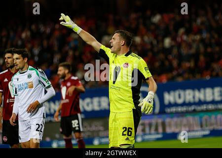 Nuremberg, Germany. 02nd Oct, 2021. Football: 2. Bundesliga, 1. FC Nürnberg - Hannover 96, Matchday 9, Max-Morlock-Stadion Nuremberg goalkeeper Christian Mathenia (r) gives instructions to his team-mates. Credit: Löb Daniel/dpa - IMPORTANT NOTE: In accordance with the regulations of the DFL Deutsche Fußball Liga and/or the DFB Deutscher Fußball-Bund, it is prohibited to use or have used photographs taken in the stadium and/or of the match in the form of sequence pictures and/or video-like photo series./dpa/Alamy Live News Stock Photo