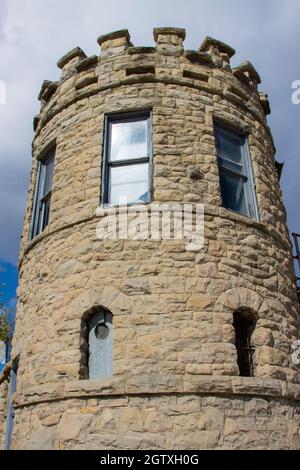 Guard tower on the wall of the historic old Montana State Prison in Deer Lodge, Montana Stock Photo