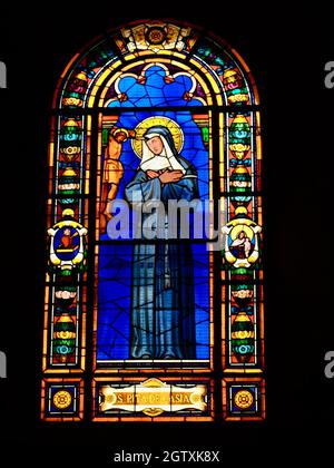 Painted glass of Santa Rita De Casia in the Iglesia de San Jose in Panama. Stock Photo