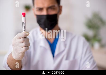 Young biochemist testing blood samples Stock Photo