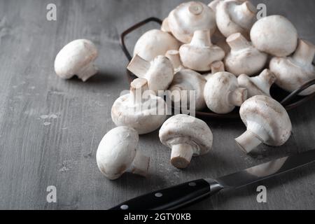 Raw fresh mushrooms on a wooden table Stock Photo