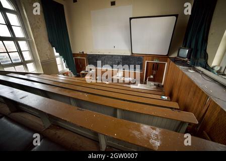 Abandoned lecture theatre inside a disused Zoology building of Liverpool University (Abandoned/Derelict) (Lecture Hall) Stock Photo