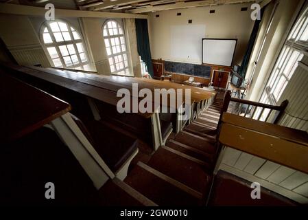 Abandoned lecture theatre inside a disused Zoology building of Liverpool University (Abandoned/Derelict) (Lecture Hall) Stock Photo