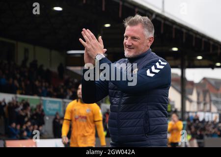 Newport, UK. 02nd Oct, 2021. Wayne Hatswell, the interim manager of Newport County applauds the fans. EFL football league two match, Newport county v Scunthorpe Utd at Rodney Parade in Newport, Wales on Saturday 2nd October 2021. this image may only be used for Editorial purposes. Editorial use only, license required for commercial use. No use in betting, games or a single club/league/player publications. pic by Credit: Andrew Orchard sports photography/Alamy Live News Stock Photo