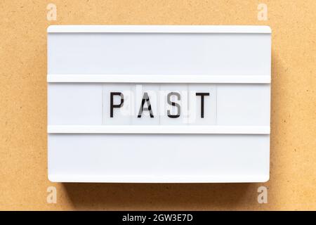 Lightbox with word past on wood background Stock Photo