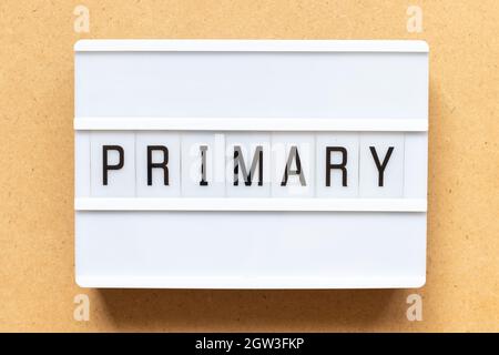 Lightbox with word primary on wood background Stock Photo