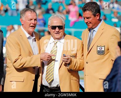 Miami Dolphin coach Don Shula (right) is expressionless as he is  congratulated by Baltimore Colts coach John Sandusky on Saturday, Dec. 16,  1972 in Miami, Fla., in the Orange Bowl. The Dolphins