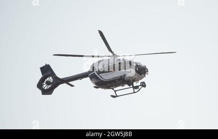 Modern police helicopter, with the latest equipment on board, against the sky, close-up. Stock Photo