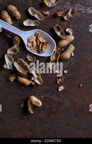 Peeled peanut on the rusty metal floor Stock Photo - Alamy