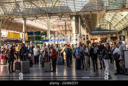 Crowds of people looking up toward the schedules in the Gare de Lyon railway station in Paris, France. Stock Photo