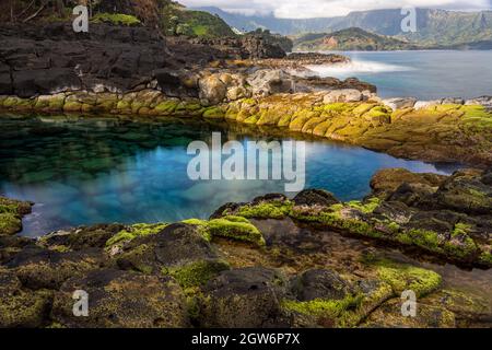 Long Exposure Of The Calm Waters Of Queen's Bath, A Rock Pool Off Princeville On North Kauai