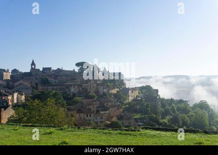 Early morning mist over the town of Belves in the south of france Stock Photo