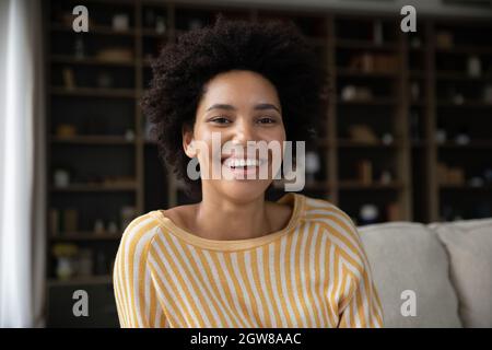 Happy young african american woman looking at camera. Stock Photo