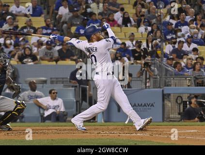 Los Angeles, United States. 03rd Oct, 2021. Los Angeles Dodgers' Justin Turner smashes three-run home run off Milwaukee Brewers' starting pitcher Corbin Burnes, a leading Cy Young Award candidate, to snatch a lead they wouldn't relinquish during the first inning at Dodger Stadium in Los Angeles on Saturday, October 2, 2021. Credit: UPI/Alamy Live News Stock Photo