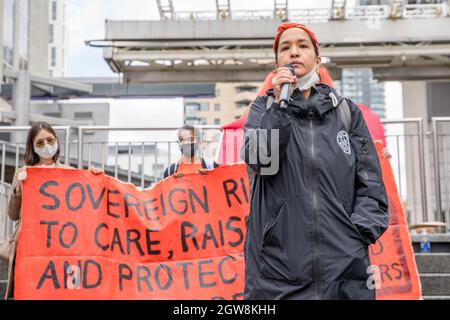 Activist Katherine Gandy, Matriarchal Circle Founder speaks during the Orange Shirt Day and National Day of Truth and Reconciliation at Dundas Square, to heal, raise awareness and rise together as an Indigenous Community.Organized by Matriarchal Circle, a Toronto-based grassroots organization impacted by child welfare agencies. The Matriarchal Circle's vision is for child welfare to be practiced in Toronto in true Indigenous grassroots led circles, 'as opposed to the neo-colonial, oppressive, genocidal acts in the current child welfare system. Stock Photo