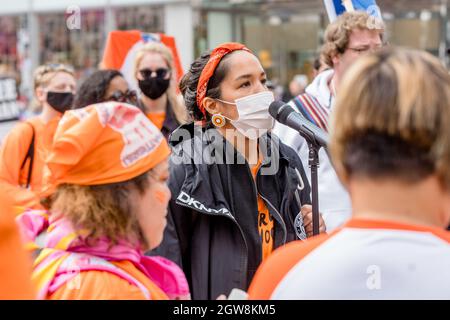 Activist Katherine Gandy, Matriarchal Circle Founder speaks during the Orange Shirt Day and National Day of Truth and Reconciliation at Dundas Square, to heal, raise awareness and rise together as an Indigenous Community.Organized by Matriarchal Circle, a Toronto-based grassroots organization impacted by child welfare agencies. The Matriarchal Circle's vision is for child welfare to be practiced in Toronto in true Indigenous grassroots led circles, 'as opposed to the neo-colonial, oppressive, genocidal acts in the current child welfare system. Stock Photo