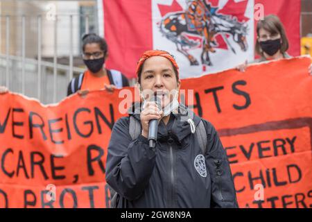 Toronto, Ontario, Canada. 30th Sep, 2021. Activist Katherine Gandy, Matriarchal Circle Founder speaks during the Orange Shirt Day and National Day of Truth and Reconciliation at Dundas Square, to heal, raise awareness and rise together as an Indigenous Community.Organized by Matriarchal Circle, a Toronto-based grassroots organization impacted by child welfare agencies. The Matriarchal Circle's vision is for child welfare to be practiced in Toronto in true Indigenous grassroots led circles, ''as opposed to the neo-colonial, oppressive, genocidal acts in the current child welfare system. (C Stock Photo