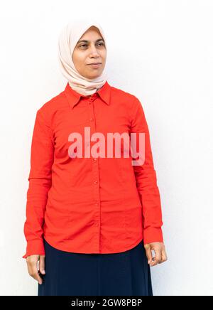 One positive woman portrait against the wall Stock Photo