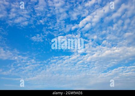blue sky with white spindrift clouds on day Stock Photo