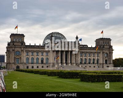 Berlin, Germany. 03rd Oct, 2021. Overcast skies can be seen over the Reichstag on German Unity Day. The German Unity Day Act came into force on 4 August 1953. In future, 17 June was to serve as a statutory national memorial day to commemorate the 1953 uprising in the GDR. Since German reunification in 1990, the 'Day of German Unity' has been celebrated on 3 October. Credit: Paul Zinken/dpa/Alamy Live News Stock Photo