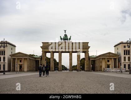 Berlin, Germany. 03rd Oct, 2021. Pariser Platz is almost deserted on German Unity Day in front of the Brandenburg Gate. The German Unity Day Act came into force on 4 August 1953. In future, 17 June was to be a statutory national day of remembrance of the uprising in the GDR in 1953. Since German reunification in 1990, the 'Day of German Unity' has been celebrated on 3 October. Credit: Paul Zinken/dpa/Alamy Live News Stock Photo