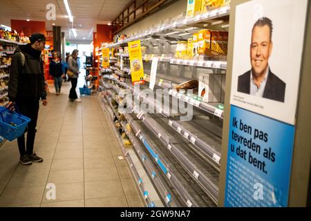 Empty shelf’s seen at supermarkets and shops. In the Netherlands due to the coronavirus majority of businesses are firm and security measures have been taken. Nevertheless, there is no containment, people remain free to go out. The government is aiming for herd immunity. Amsterdam, the Netherlands. Stock Photo