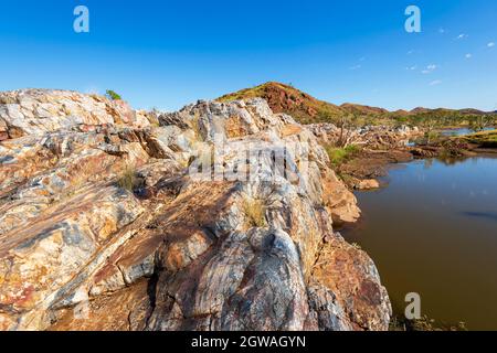 Amazing jasper rock formations at Chinaman's Pool, a popular picnic and swimming spot near Marble Bar, Pilbara, Western Australia, Australia Stock Photo
