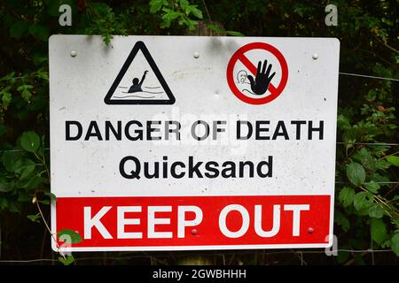 Danger of Death Quicksand Keep Out sign at Paxton Pits working quarry. Paxton Pits Nature Reserve, Little Paxton, Cambridgeshire, UK Stock Photo