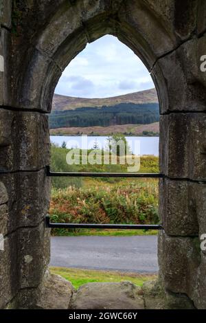 LOCH DOON, SCOTLAND - SEPTEMBER 18, 2019 :  A View to loch Doon through an archway  of the ruins Loch Doon Castle  South Ayrshire Scotland Stock Photo