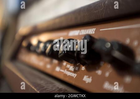 Fine-tune controls of retro style amplifier device. Selective focus Stock Photo