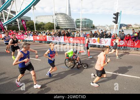 London, UK. 3rd Oct, 2021. People running in the 2021 London Marathon at Tower Bridge. Credit: SMPNEWS/Alamy Live News Stock Photo