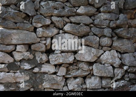 Wall of natural stones of gray color. Stock Photo