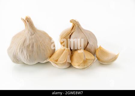 Garlic heads with garlic cloves isolated on white background Stock Photo
