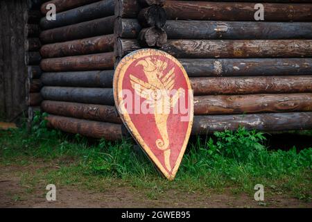 Reconstruction of middle ages - slavic shield near wooden fortress Stock Photo