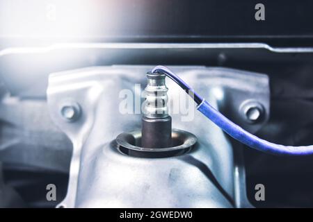 Oxygen sensor O2 on the header exhaust pipe for calculate mixing of engine ignition system in the car, Automotive parts concept. Stock Photo