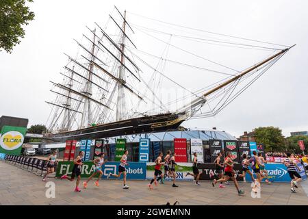 03/10/2021. London, UK. Runners run past the Cutty Sark during the London Marathon 2021. Photo by Ray Tang. Stock Photo