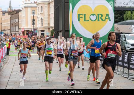 03/10/2021. London, UK. Runners run past the Cutty Sark during the London Marathon 2021. Photo by Ray Tang. Stock Photo