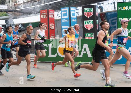 03/10/2021. London, UK. Runners run past the Cutty Sark during the London Marathon 2021. Photo by Ray Tang. Stock Photo