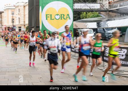 03/10/2021. London, UK. Runners run past the Cutty Sark during the London Marathon 2021. Photo by Ray Tang. Stock Photo