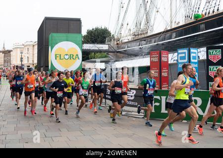 03/10/2021. London, UK. Runners run past the Cutty Sark during the London Marathon 2021. Photo by Ray Tang. Stock Photo