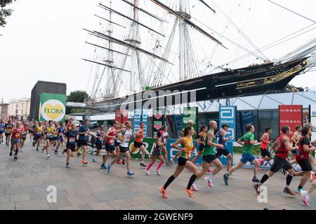 03/10/2021. London, UK. Runners run past the Cutty Sark during the London Marathon 2021. Photo by Ray Tang. Stock Photo