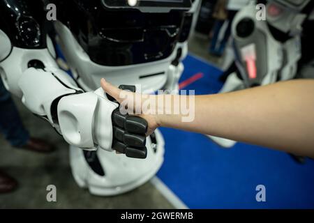 Shaking hands with a robot Stock Photo