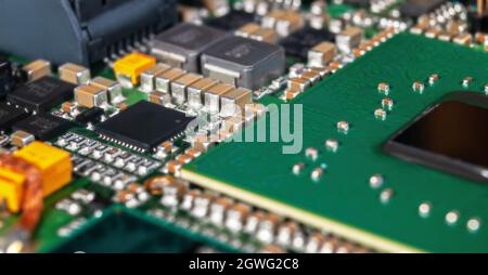 electronic circuit board with passive and active circuit components and IC close-up Stock Photo