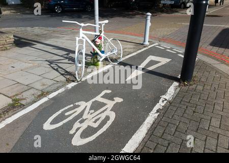 A cycle ghost bike (also referred to as ghostcycle or WhiteCycle) bicycle roadside memorial, where a cyclist was killed in Richmond, London UK. (127) Stock Photo