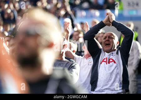 Tottenham Hotspur fans cheer on their team during the Premier League match at the Tottenham Hotspur Stadium, London. Picture date: Sunday October 3, 2021.