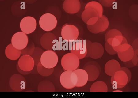 Defocused lights. Red bokeh on black background. Christmas and New year overlay. Copy space Stock Photo
