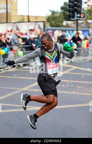London, UK. 3rd Oct, 2021. South African Fusi Motsamai (Bib 43358), running in the Virgin Money London Marathon near Commercial Road London. Credit: Simon Balson/Alamy Live News Stock Photo